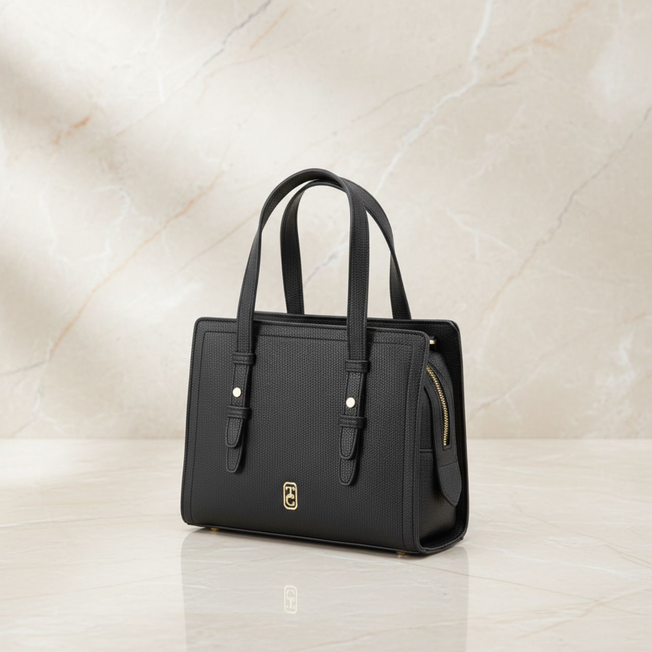 The Tipperary Madison Handbag in Black combines timeless elegance with practical design. Crafted to complement sophisticated ensembles, its sleek silhouette offers ample space for everyday essentials without compromising style.