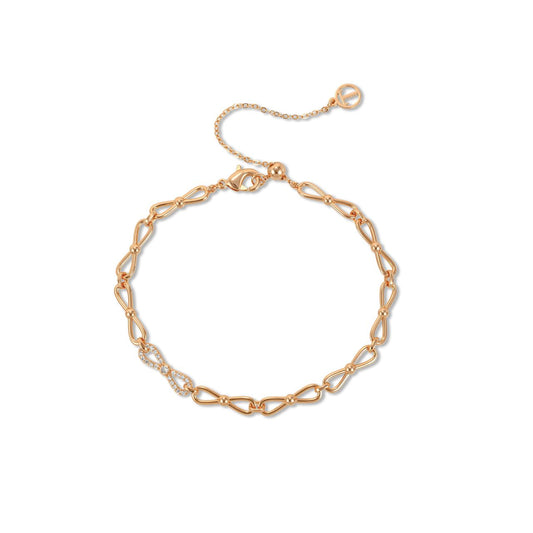 Elegant mini bow bracelet crafted in gold-tone finish, adorned with sparkling cubic zirconia stones. This delicate piece from Tipperary combines timeless design with contemporary sparkle, perfect for everyday wear or special occasions.