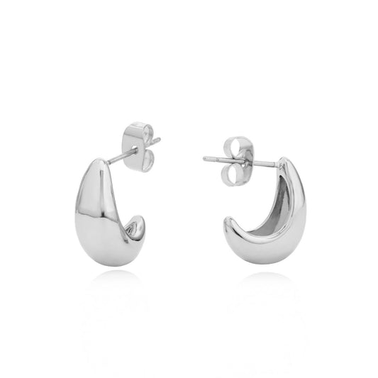 Elevate your everyday elegance with the Tipperary Mini Pebble Hoop Earrings in silver. These delicately crafted hoops feature a subtle pebble texture that catches the light beautifully, adding a refined touch to any outfit.