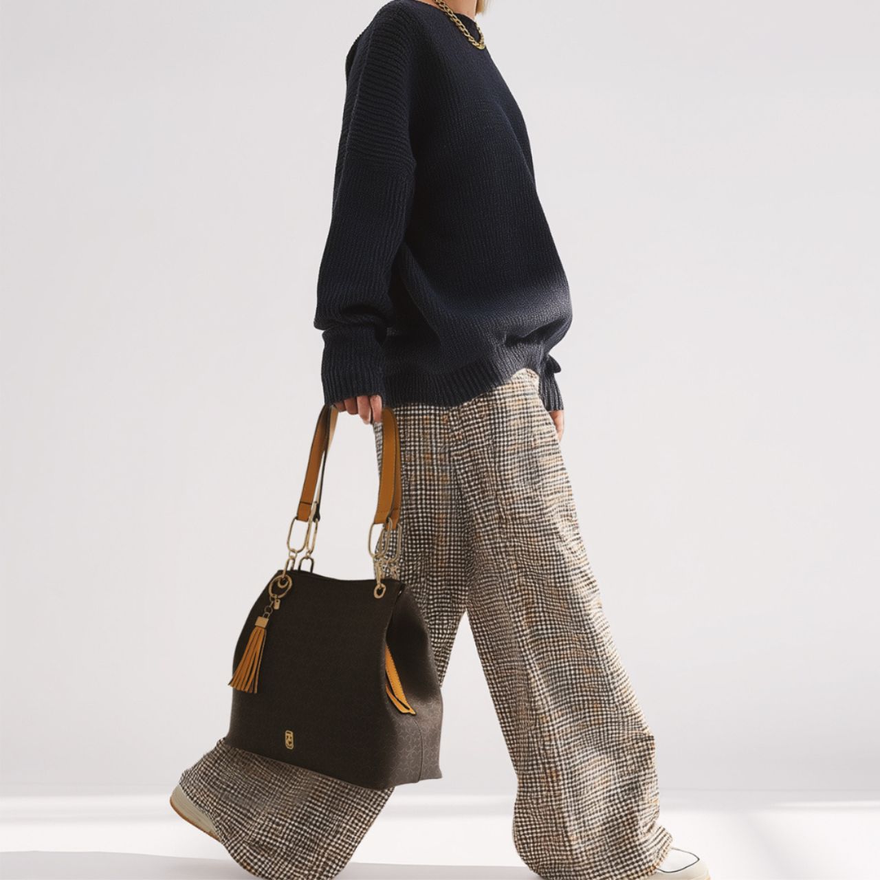 The Tipperary Monogram Tote in Mocha is a sophisticated accessory designed for the discerning user. Crafted with attention to detail, its rich mocha hue complements a variety of styles while the monogram adds a personalized touch.