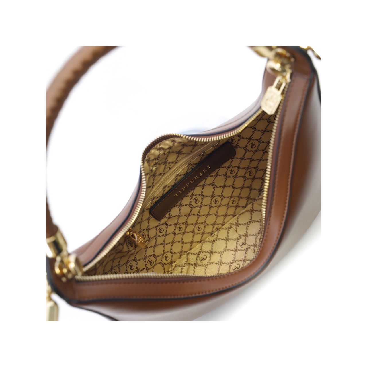 The Tipperary Moon Handbag in tan offers a refined blend of style and practicality for summer 2025. Crafted with attention to detail, its sleek silhouette and warm tan hue complement a variety of outfits, making it an essential accessory for the season.