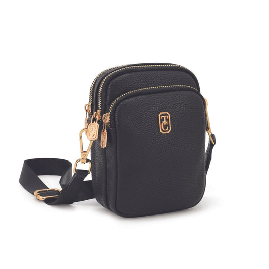 Experience convenience and style with the Tipperary Naples Mini Cross Body Bag. This sleek black bag by Tipperary is perfect for all your essentials, making it the perfect companion for any day out. Stay organized and effortlessly chic with this versatile bag.