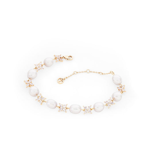 Introducing the sophisticated Gold Natural Pearl &amp; CZ Bracelet by Tipperary. Made with genuine pearls and sparkling cubic zirconia, this elegant piece will elevate any outfit. Expertly crafted with a timeless design, this bracelet is perfect for adding a touch of luxury and glamour to your style.