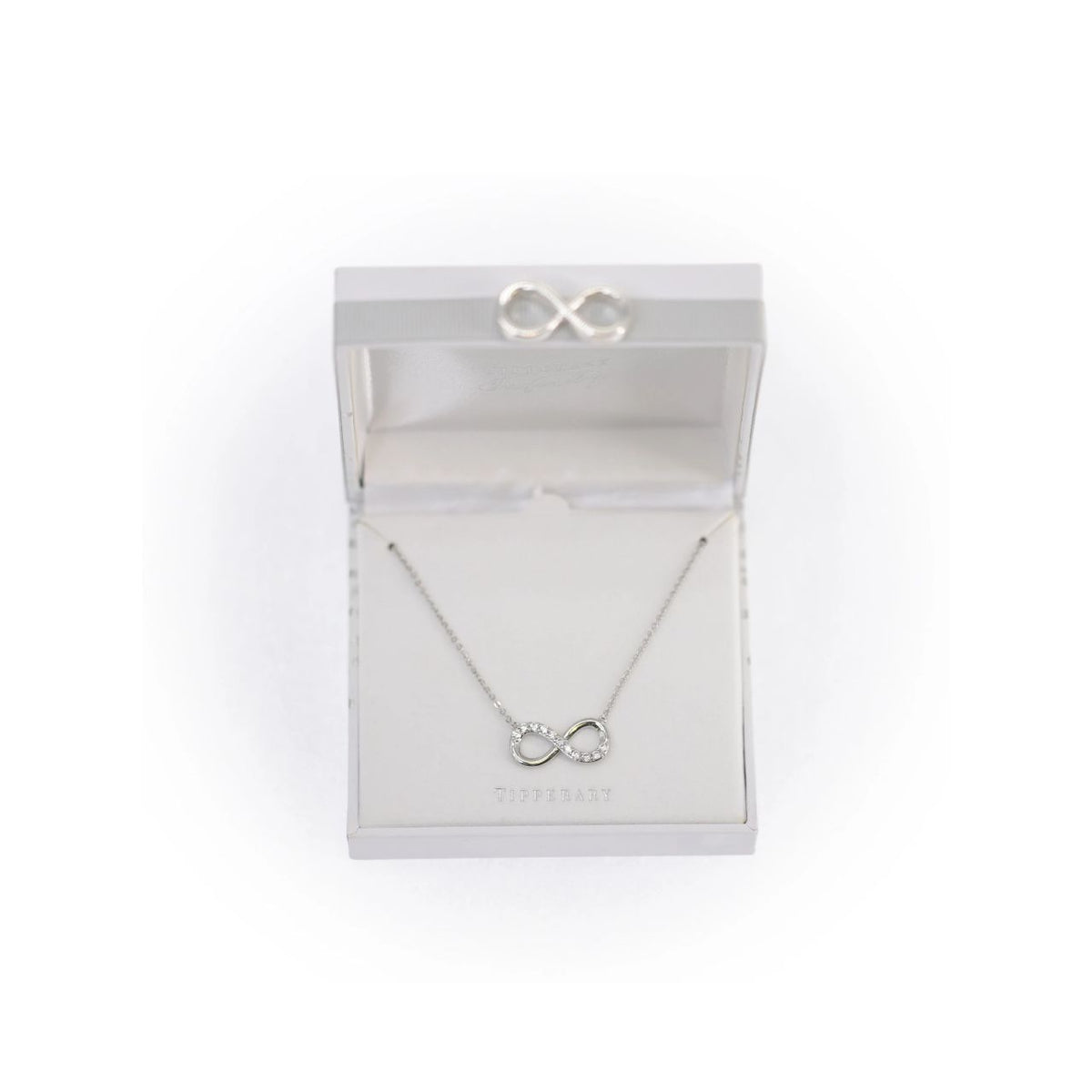 Sleek, sophisticated and eternally elegant, gift that special someone with this shimmering necklace and celebrate your eternal love. This design is on trend in cool silver and features a ﬂowing inﬁnity symbol adorned with a glittering splash of bright clear crystals.