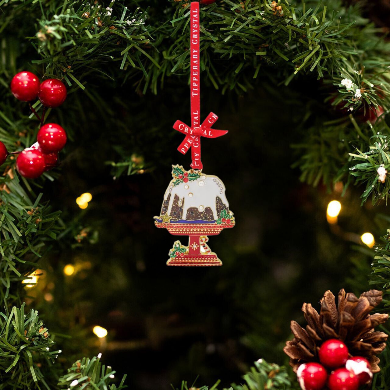 This exquisite Tipperary Pudding Sparkle Christmas Decoration adds a touch of elegance to any holiday celebration. Crafted by Tipperary, this delicately designed decoration features intricate details and a sparkling finish, making it the perfect addition to your Christmas décor. Bring joy and cheer to your home with this festive piece.