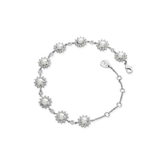 Beautifully classic, this stunning silver station bracelet will complement any attire. Nine luminous, white pearls sit centred in the flower inspired sunbursts, surrounded by a halo of shimmering clear, round crystals.