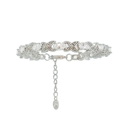 Silver Bracelet X&O by Tipperary  Making an impressive statement of love, this sassy necklace is fashioned in timeless silver. The design features a scintillating row of hugs and kisses in a stylised "XO" fashion. A series of clear, oval crystals replaces each "O," while beautiful crystal pavé accents and a beaded detail decorate the whimsical "X" shapes in between.
