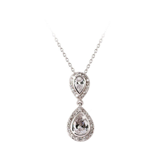 Silver Pendant Pear Shape Drop by Tipperary Crystal  A regal and elegant look, this pear-drop pendant will captivate for sure. Fashioned in sleek silver, the eye is drawn to the luminous pear-shaped white center stone bordered with a frame of shimmering crystal accents. A silver bridge connects this drop to a smaller version of itself which acts as a stunning bale.