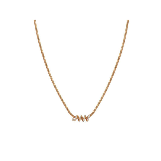 This gold snake chain necklace carries a sparkling snake coiled around the centre. It can be worn on its own to dress up a daytime outfit or paired with matching hoop earrings for a coordinated look.