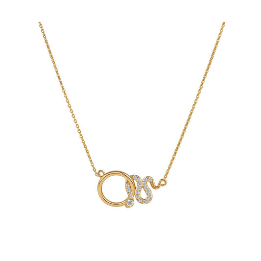 This gold necklace features a polished circle linked to a snake set with clear stones. It can be worn on its own to dress up a daytime outfit or layered with other necklaces from the Snake collection.