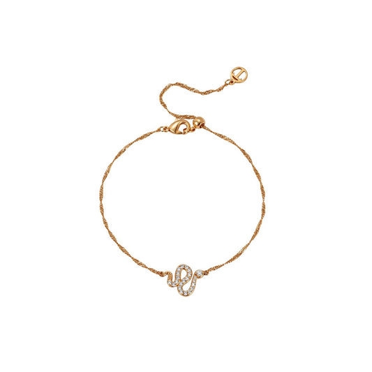 This fine gold bracelet features a twisted chain with a small snake set with clear stones. It is a delicate everyday piece that layers well with other bracelets. It secures with an adjustable lobster claw clasp. Presented in a beautifully detailed snake-themed gift box.