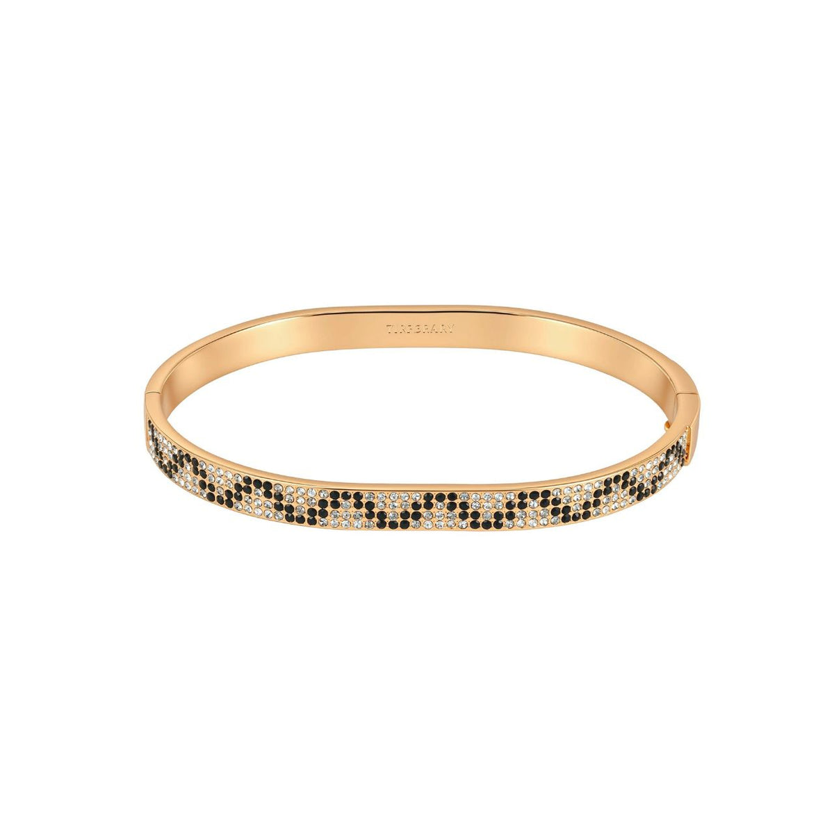 This gold bangle is set with black and clear stones in a snakeskin pattern. It adds a bold touch to an evening outfit and looks great stacked with a plain gold bangle. It secures with a hinged clasp.