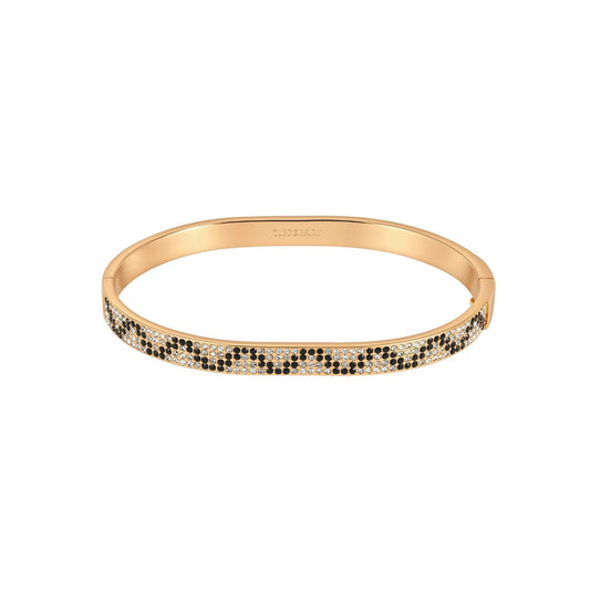 This gold bangle is set with black and clear stones in a snakeskin pattern. It adds a bold touch to an evening outfit and looks great stacked with a plain gold bangle. It secures with a hinged clasp.