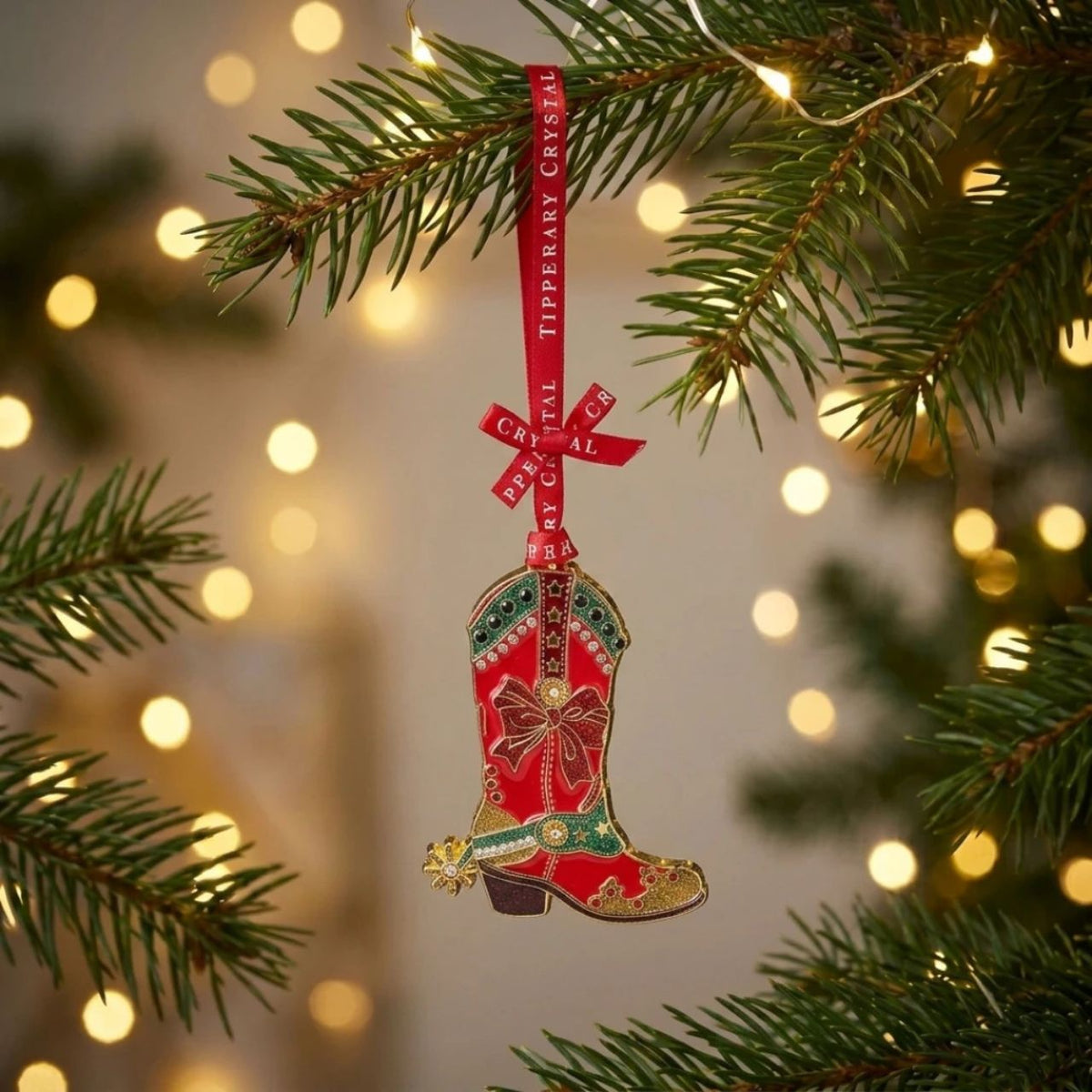 Add a touch of Western charm to your Christmas tree with this striking red cowboy boot, finished with sparkling details and a green festive design.