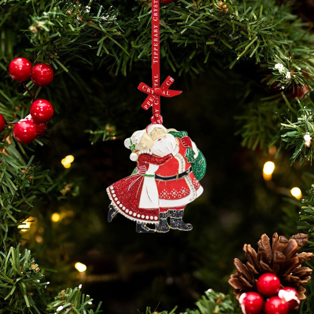 This special Sparkle Mr &amp; Mrs Claus Christmas Hanging Decoration by Tipperary is the perfect addition to your holiday décor. Featuring a glossy finish and hand-painted detailing, it will bring festive cheer to your home. Crafted from high-quality materials, this durable decoration is sure to last through the seasons.