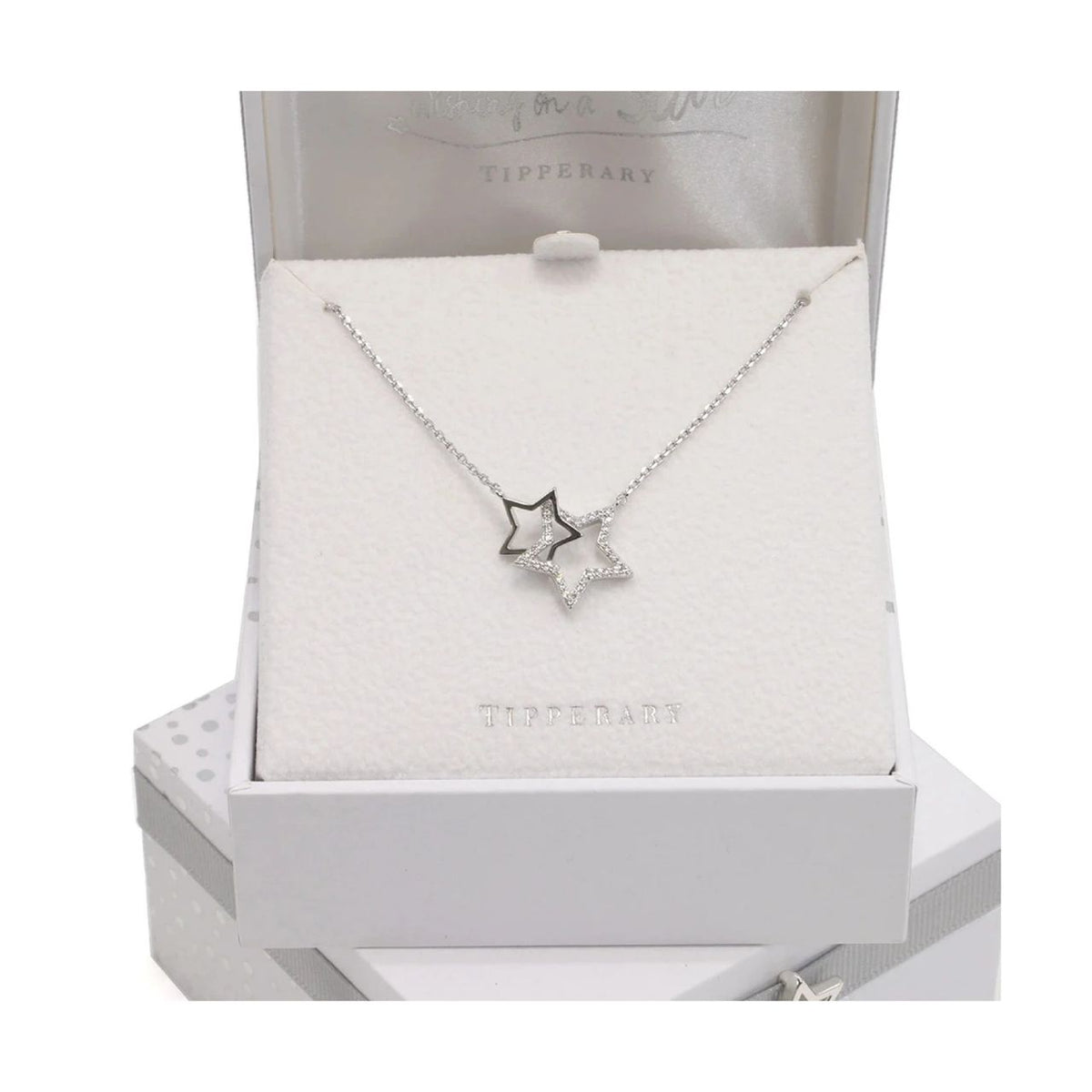 These on-trend interlocking stars come in silver. A larger crystal encrusted star is interlocked with a lustrous polished gold star. This pendant suspends from a cable chain which secures safely with a lobster claw clasp.