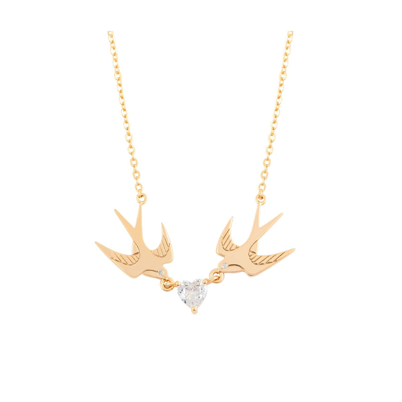 The Swallow Pendant 2 Swallows and Heart CZ – Gold showcases two gold swallows soaring towards a radiant heart-shaped CZ crystal. This pendant represents love, freedom, and the beauty of connection. With its graceful design and glimmering heart, it brings a sense of romance and elegance, making it an ideal accessory for any special occasion.