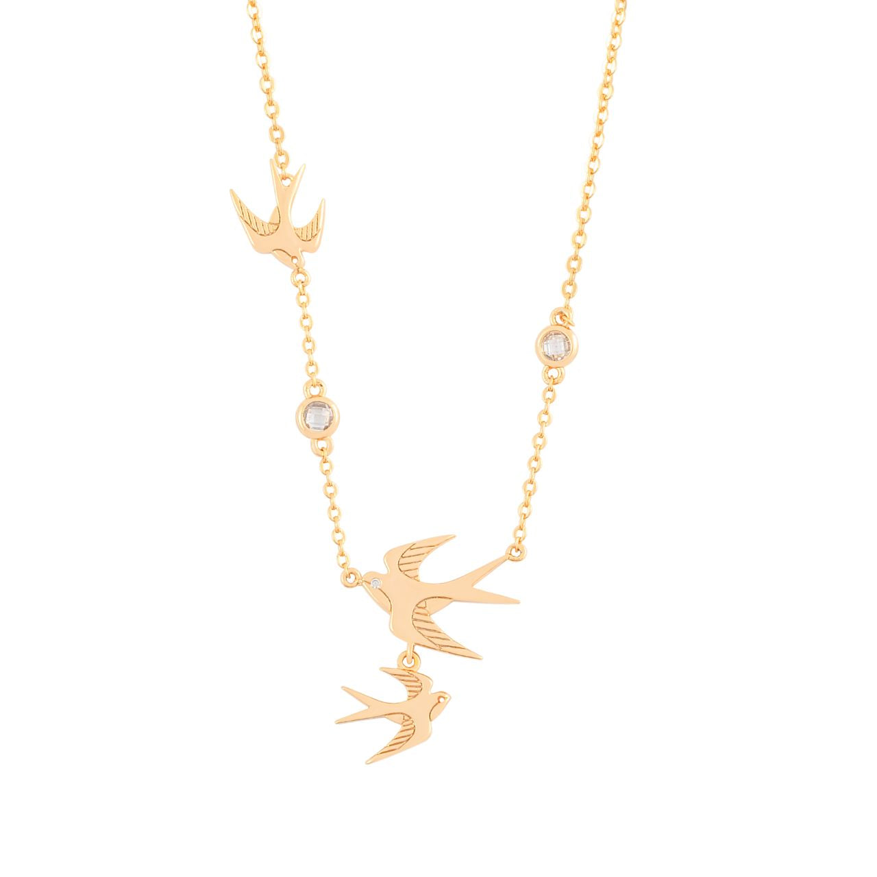 The Swallow Pendant 3 Swallows &amp; Clear CZ – Gold is a stunning piece that embodies freedom and elegance. It features three gracefully soaring swallows, symbolizing adventure and fresh beginnings. The detailed design, adorned with shimmering clear CZ crystals, adds a touch of brilliance and sophistication.