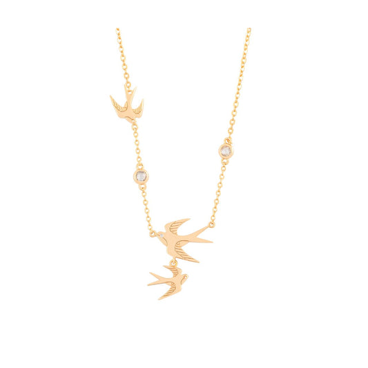 The Swallow Pendant 3 Swallows &amp; Clear CZ – Gold is a stunning piece that embodies freedom and elegance. It features three gracefully soaring swallows, symbolizing adventure and fresh beginnings. The detailed design, adorned with shimmering clear CZ crystals, adds a touch of brilliance and sophistication.