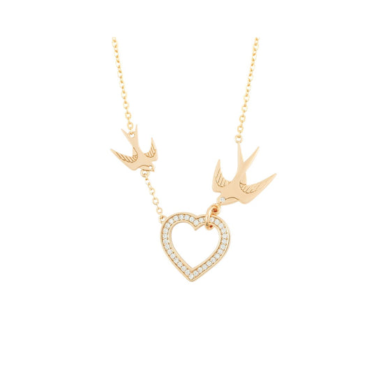 The Swallow Pendant Heart and Swallows - Gold is a beautifully crafted piece that combines elegance with symbolic meaning. Featuring a delicate heart design adorned with two graceful swallows, this pendant represents love, freedom, and safe journeys.