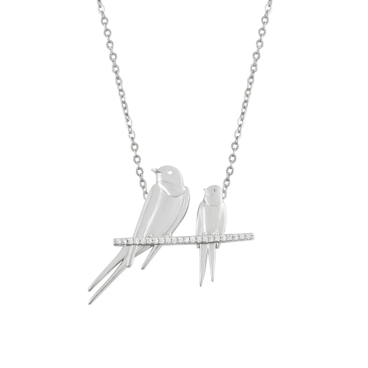 The Swallow Pendant &nbsp;Two Swallows at Rest – Silver &nbsp;is a beautifully detailed piece that symbolizes peace, love, and harmony. This pendant features two swallows perched delicately on a branch, capturing a serene and tranquil moment. Its elegant design and lustrous silver finish make it a timeless accessory, perfect for adding a meaningful touch to any outfit.
