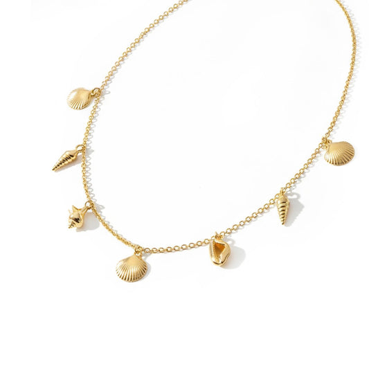 Dive into elegance with this stunning Under The Sea Shell Necklace in gleaming gold. Inspired by the ocean's natural treasures, this piece captures the delicate beauty of seashells in a timeless design.