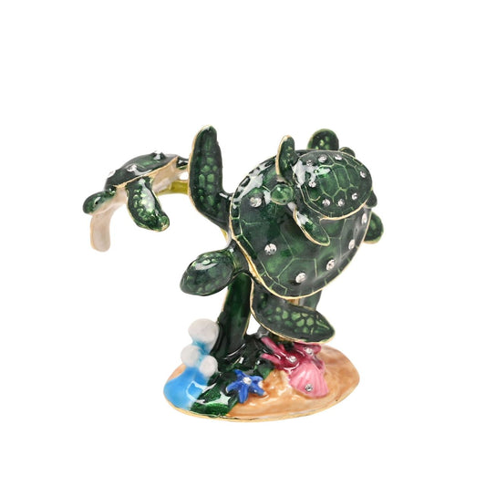 Step into the enchanting world of the Treasured Trinkets – Coral Turtle by STRATTON, a whimsical and meticulously crafted trinket box that captures the endearing charm of this sea creature.