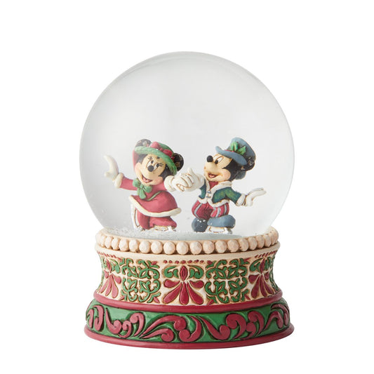 Jim Shore Splendid Skaters - Victorian Mickey and Minnie Mouse Waterball  Mickey and Minnie Mouse are filled with Christmas spirit as they ice skate in this victorian inspired waterball. Unique variations should be expected as this product is hand painted. Packed in a branded gift box. Not a toy or children's product.
