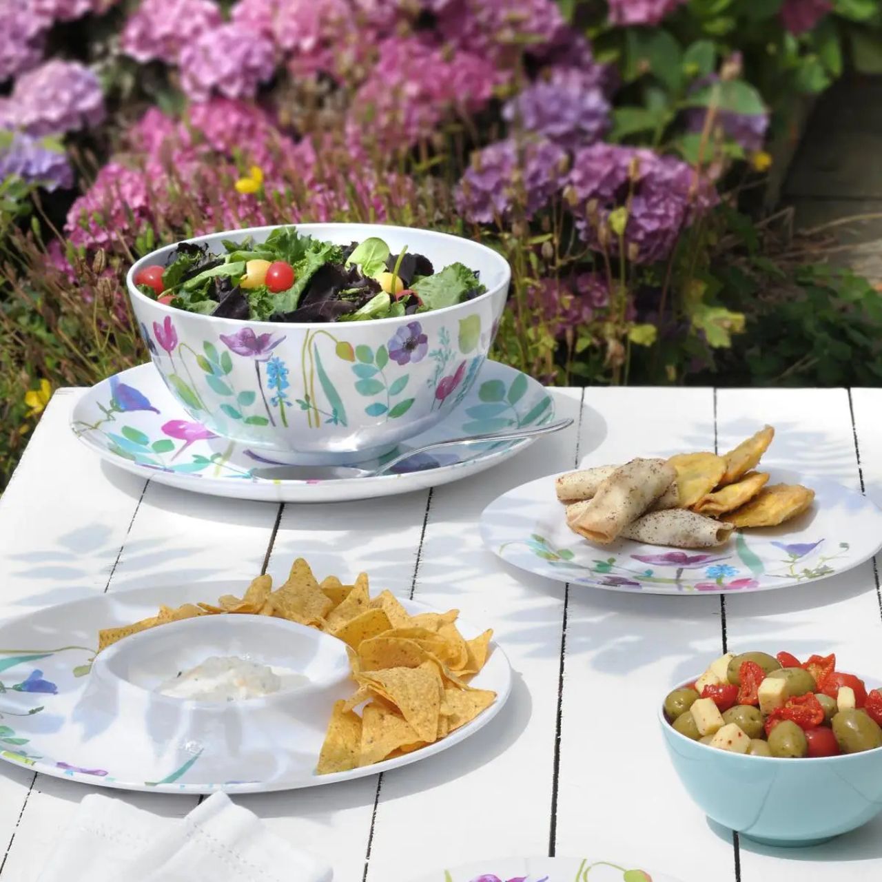 Bring vibrancy to every meal with these beautiful floral side plates