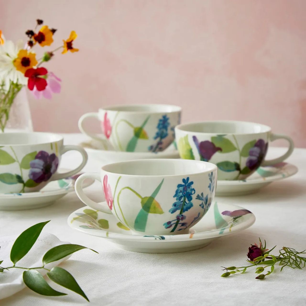 This vibrant, floral breakfast cup and saucer set will brighten up every morning. With a generous capacity, these porcelain cups are decorated with the Water Garden pattern in pretty pastel shades.