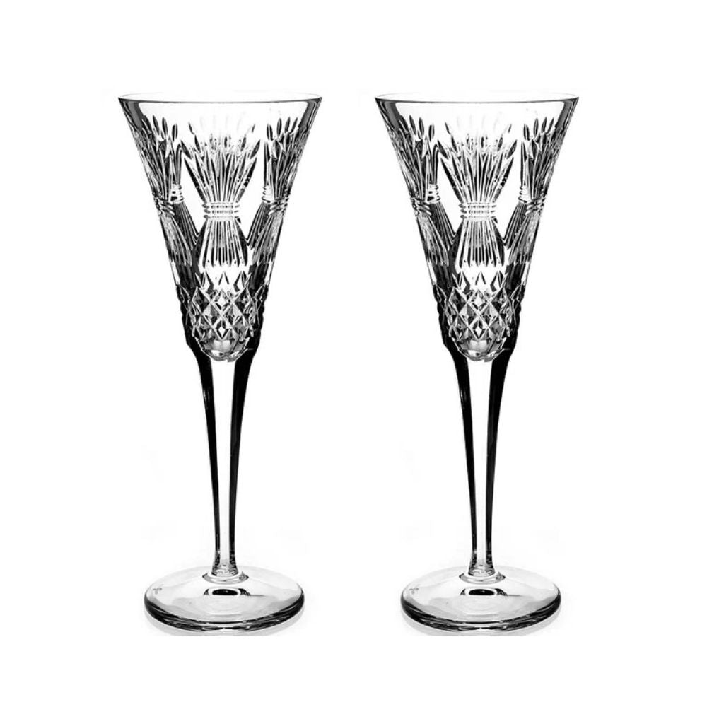 Waterford Crystal Millennium Collection Toasting Flutes - Prosperity  The collection was started in 1995. Each year a set of two flutes dedicated to one of the universal toasts was made available. The first flute was Happiness, engraved with a bow, the next Love, with a heart, then Health with a sunburst, Prosperity with a wheat sheaf and Peace with a dove