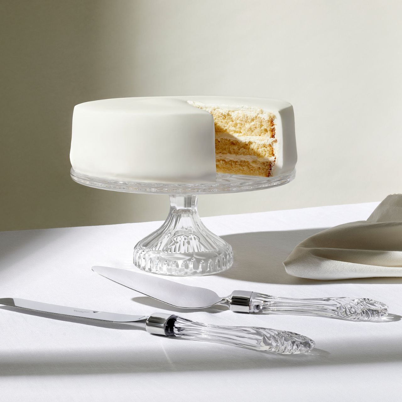 Lismore Cake Plate - Footed by Waterford Crystal  Featuring the iconic Lismore pattern, the Lismore Gift Bar Collection is inspired by the rich heritage of Ireland with pieces designed to be used and enjoyed. The Lismore Cake Plate 11 inch is perfect for serving up delicious cakes, sandwiches and biscuits. Lismore's signature diamond and wedge cuts create a brilliance and clarity that turns ordinary presentations into a special event.
