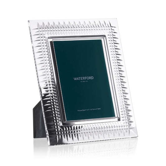 Lismore Diamond Picture Frame 5 x 7 by Waterford Crystal  The Lismore Diamond pattern is an enduring reinvention of the Waterford classic; characterised by intricate diamond cuts rendered in radiant fine crystal. The Lismore Diamond 5 x 7 Crystal Picture Frame displays life’s most special moments with crystal-clear clarity and strikingly modern design.