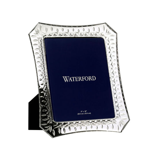 Waterford Crystal Lismore Picture Frame 8 x 10in  Bring your treasured memories to life with this stunning Lismore 8 x 10 Picture Frame, a generously sized crystal photo frame that’s perfect for displaying on a desk, mantle or table. Crafted from fine crystal, and intricately adorned with our beloved Lismore pattern, this elegant picture frame is a stunning combination of brilliance and clarity that effortlessly enhances your fondest memories.