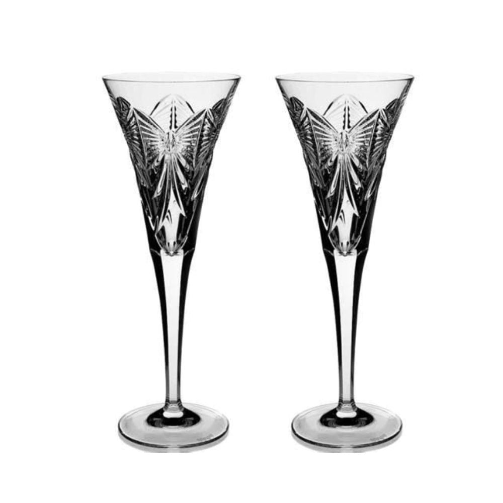Waterford Crystal Millennium Collection Toasting Flutes - Happiness  The collection was started in 1995. Each year a set of two flutes dedicated to one of the universal toasts was made available. The first flute was Happiness, engraved with a bow, the next Love, with a heart, then Health with a sunburst, Prosperity with a wheat sheaf and Peace with a dove.