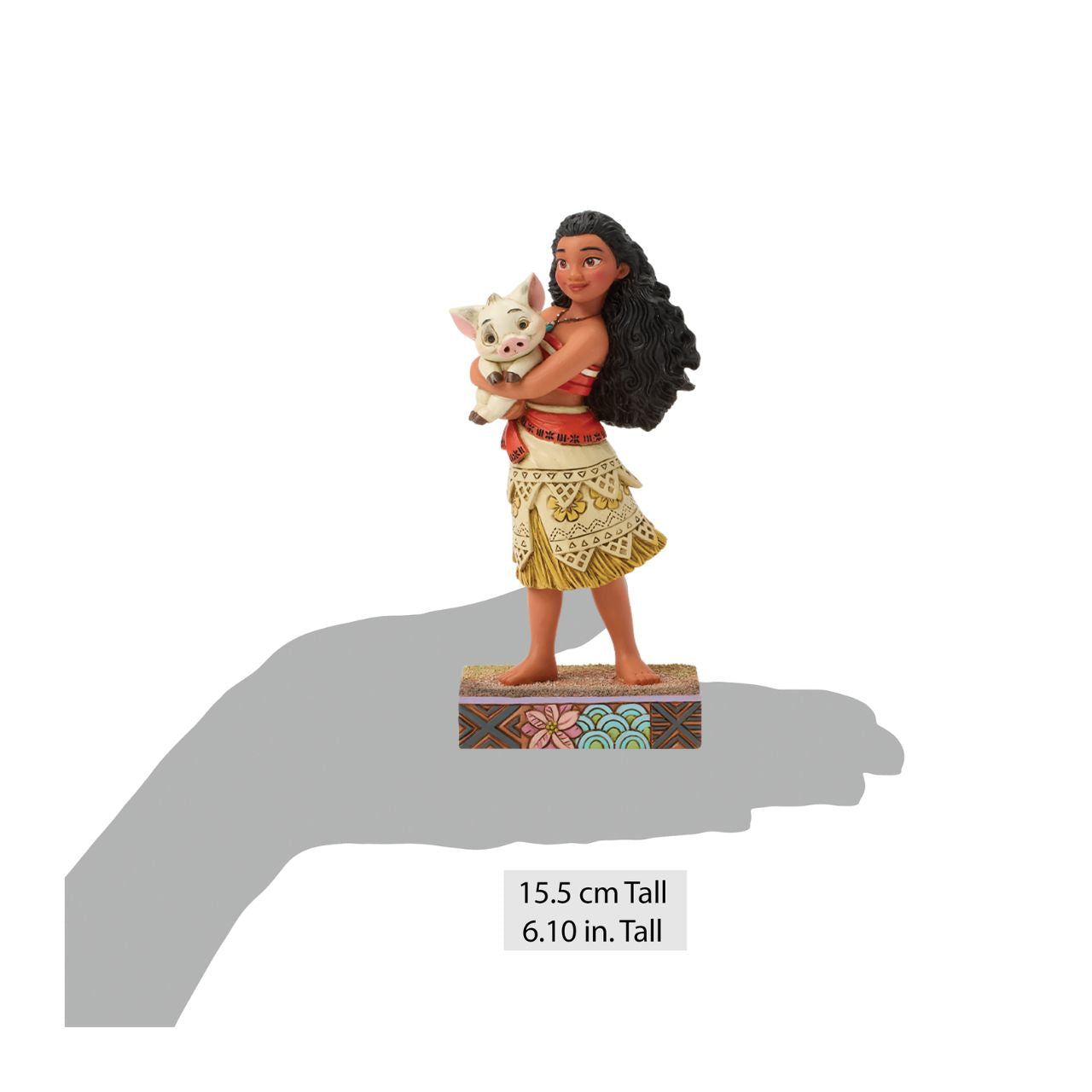 This intricate Jim Shore scene depicts Moana holding her best friend, Pua the pig, in a tight embrace. They smile together on a sand stage, with textured patterns and vibrant colour. Jim Shore's warm craftsmanship brings the scene to life.