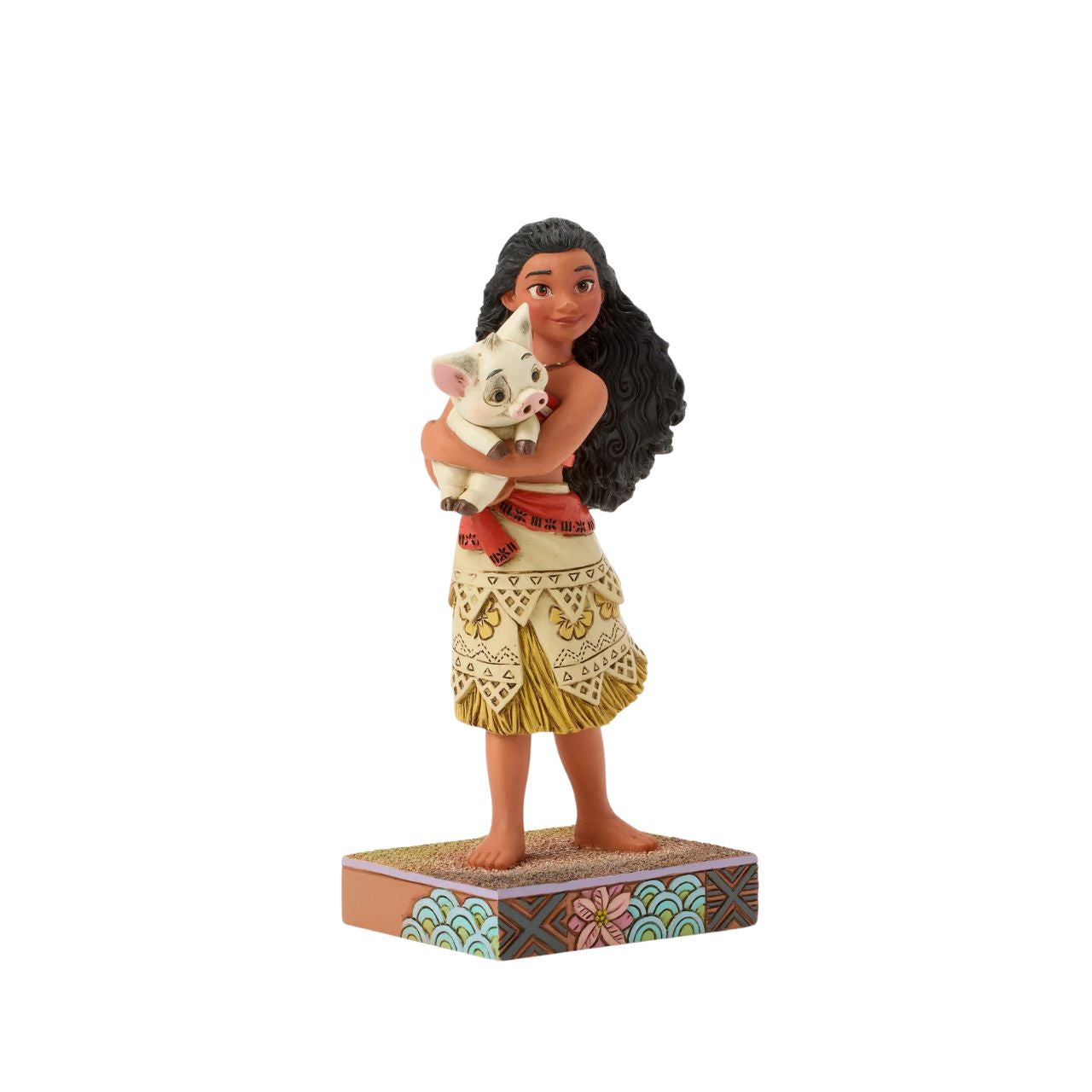 This intricate Jim Shore scene depicts Moana holding her best friend, Pua the pig, in a tight embrace. They smile together on a sand stage, with textured patterns and vibrant colour. Jim Shore's warm craftsmanship brings the scene to life.