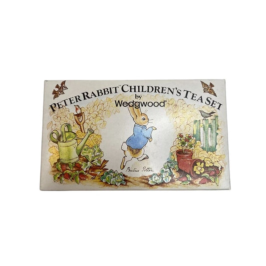 Experience the charm of Beatrix Potter's beloved character, Peter Rabbit, with our Vintage porcelain Children's Tea Set by Wedgwood. This 3 piece set includes a teapot, cup, and saucer, all adorned with delicate illustrations and crafted with renowned Wedgwood quality. Share precious moments and create cherished memories with this timeless tea set.