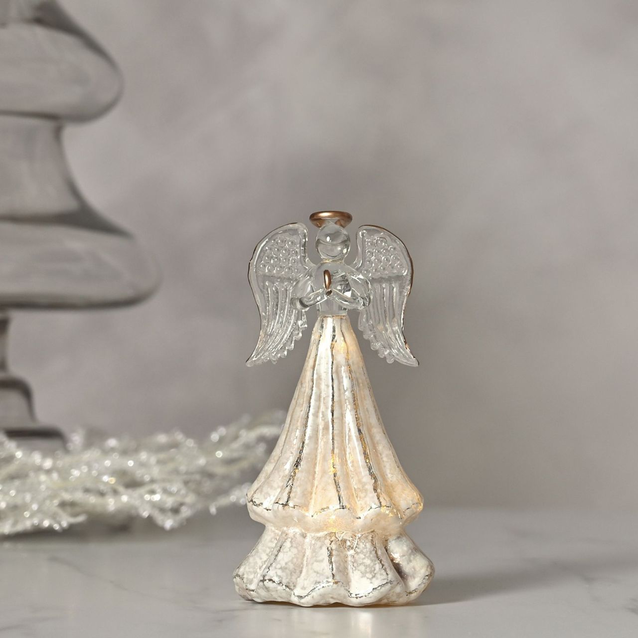 White Angel LED Light  A white angel LED light by THE SEASONAL GIFT CO.  This divine angel provides gorgeous decoration for Winter Wonderlands at home.