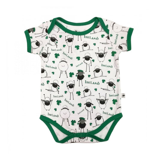 White & Green Overall Printed Sheep Baby Vest  This white and green baby vest is part of the Traditional Craft Official Collection. This white cotton vest has an emerald green trim on the neck, sleeves and bottom. The vest is designed with an over all print of sheep, shamrocks & Ireland logo's from the Flaherty Flock range.