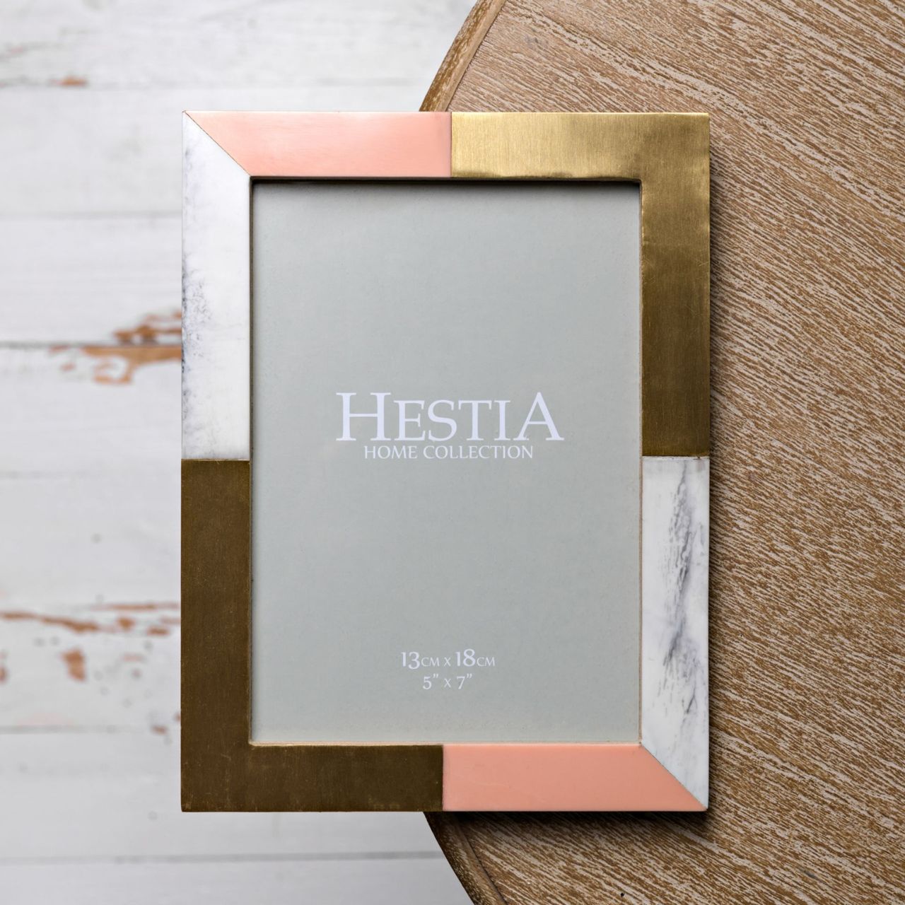 Give a precious snap the perfect place to shine with this gorgeous resin frame with brass inlay details.