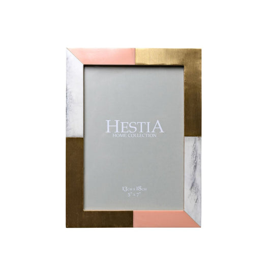 Give a precious snap the perfect place to shine with this gorgeous resin frame with brass inlay details.