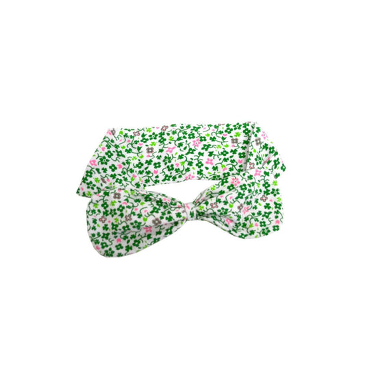 This cute white hairband is part of the Traditional Craft Official Collection. It is designed with overall printed green and pink small shamrocks and features a large but subtle bow on top.