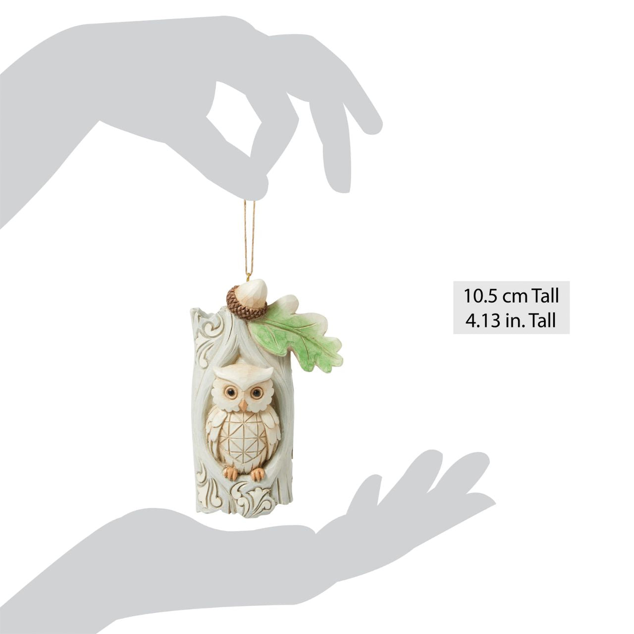 This delightful Jim Shore ornament features a charming owl nestled comfortably in the hole of an acorn tree, capturing the serenity of woodland life. With intricate detailing, this piece adds a touch of nature-inspired charm to your holiday tree.
