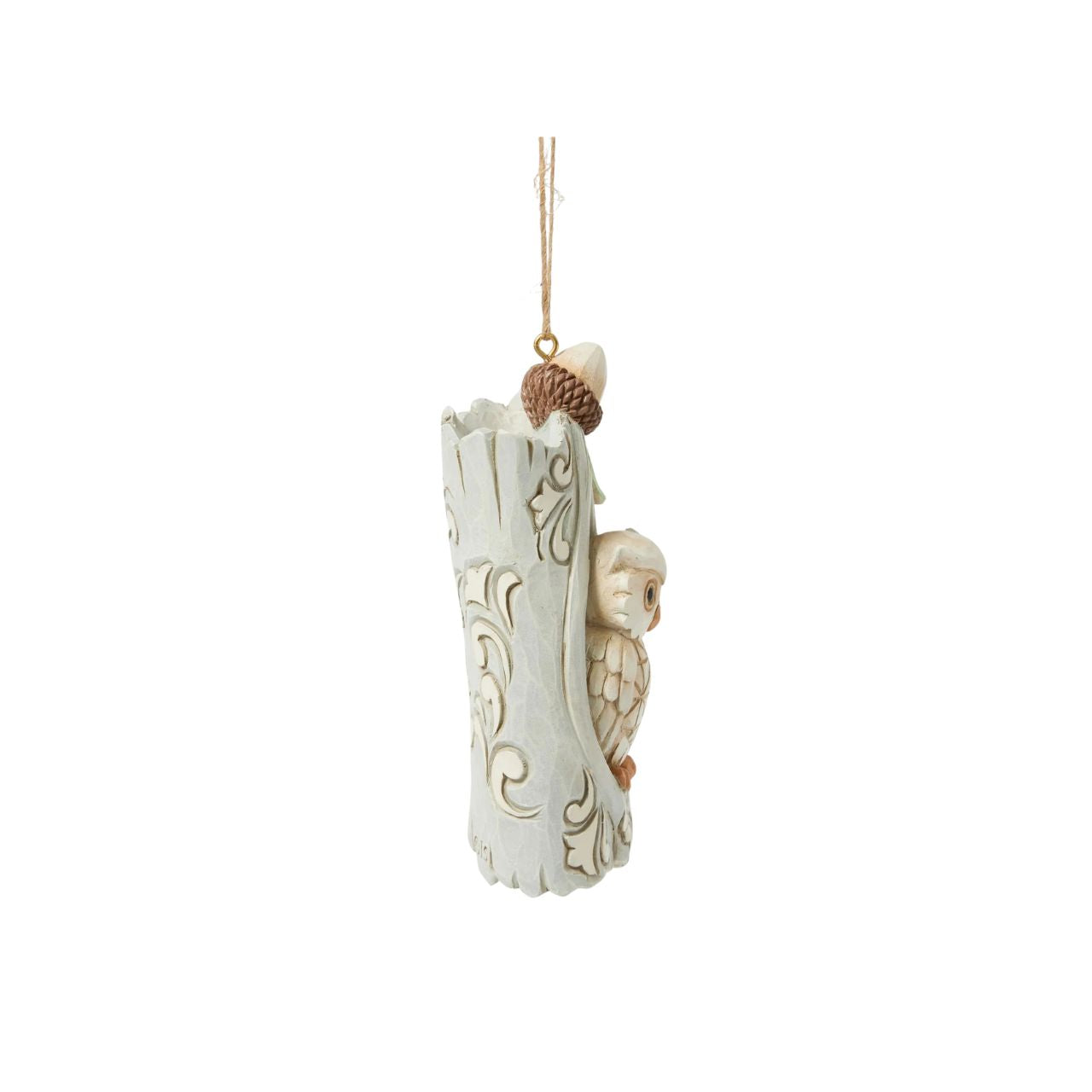 This delightful Jim Shore ornament features a charming owl nestled comfortably in the hole of an acorn tree, capturing the serenity of woodland life. With intricate detailing, this piece adds a touch of nature-inspired charm to your holiday tree.
