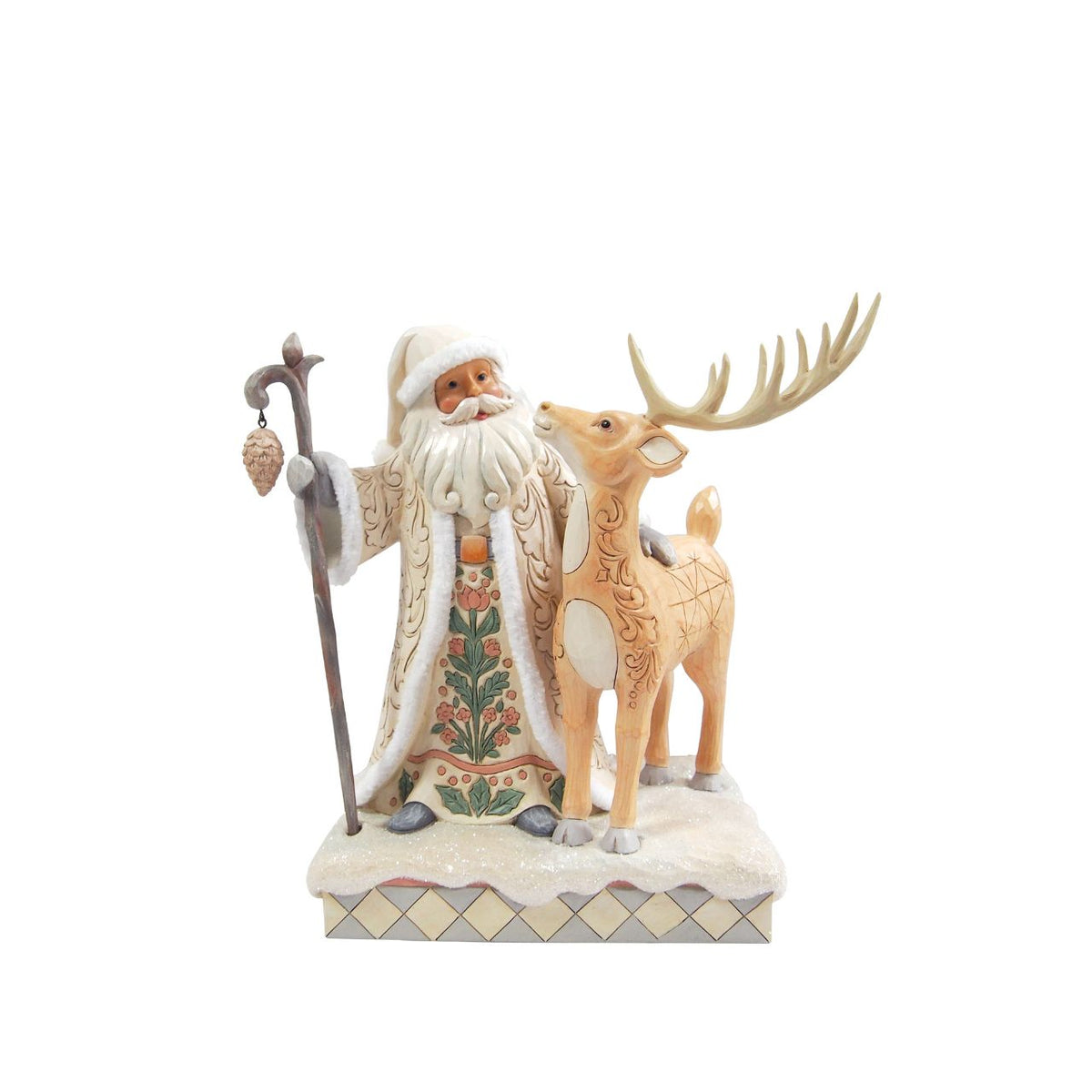 Celebrate the magic of Christmas with the Woodland Santa with Buck figurine from the Heartwood Creek collection by Jim Shore. This delightful figurine portrays Santa Claus in a heartwarming scene with a majestic buck, embodying the serene beauty of a winter forest.