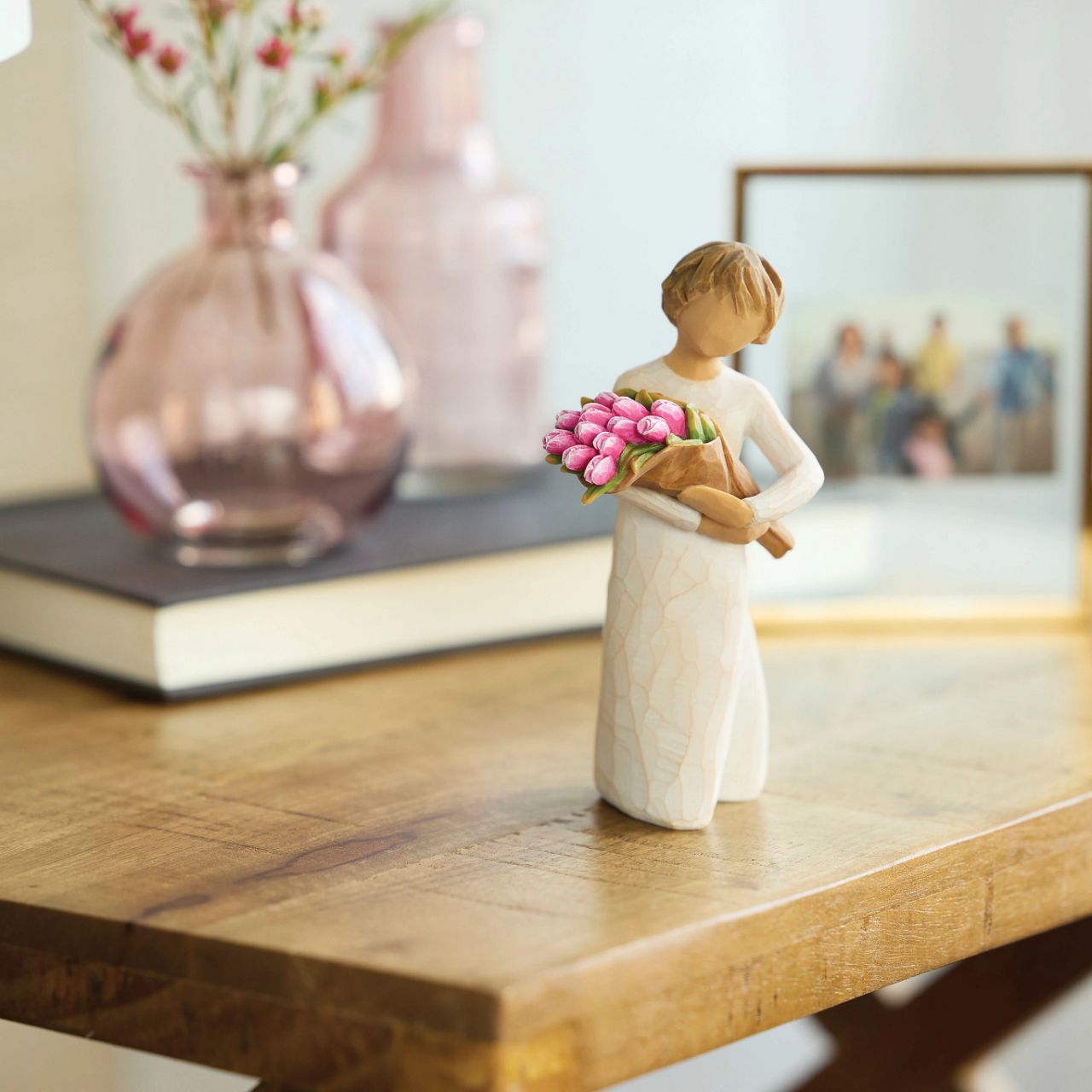 The bright and boldly pink colour of these tulips can represent courage, strength and confidence. One of the earliest blooms in spring, tulips are associated with hope and renewal. The large bouquet can represent one's community of support and friendship.