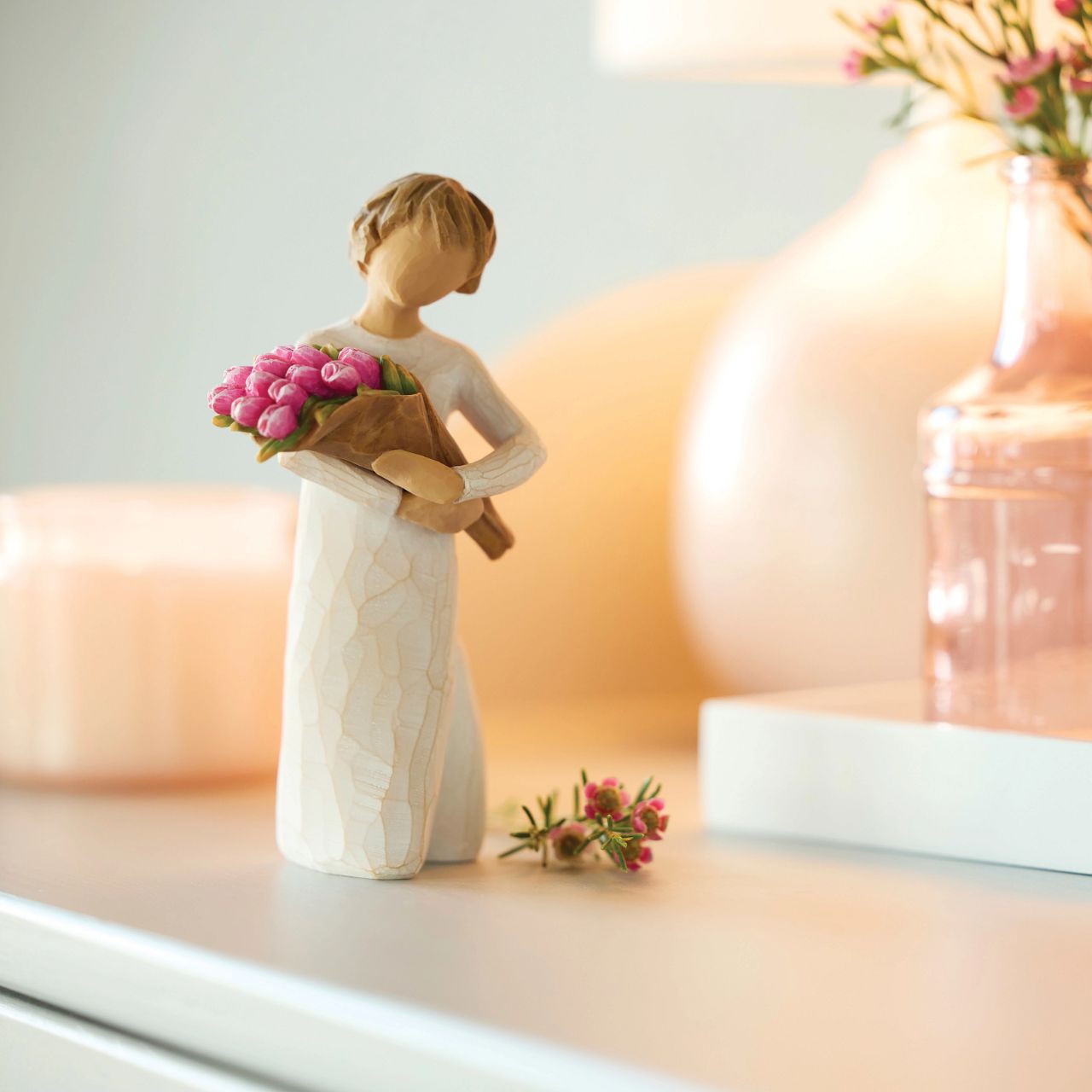 The bright and boldly pink colour of these tulips can represent courage, strength and confidence. One of the earliest blooms in spring, tulips are associated with hope and renewal. The large bouquet can represent one's community of support and friendship.