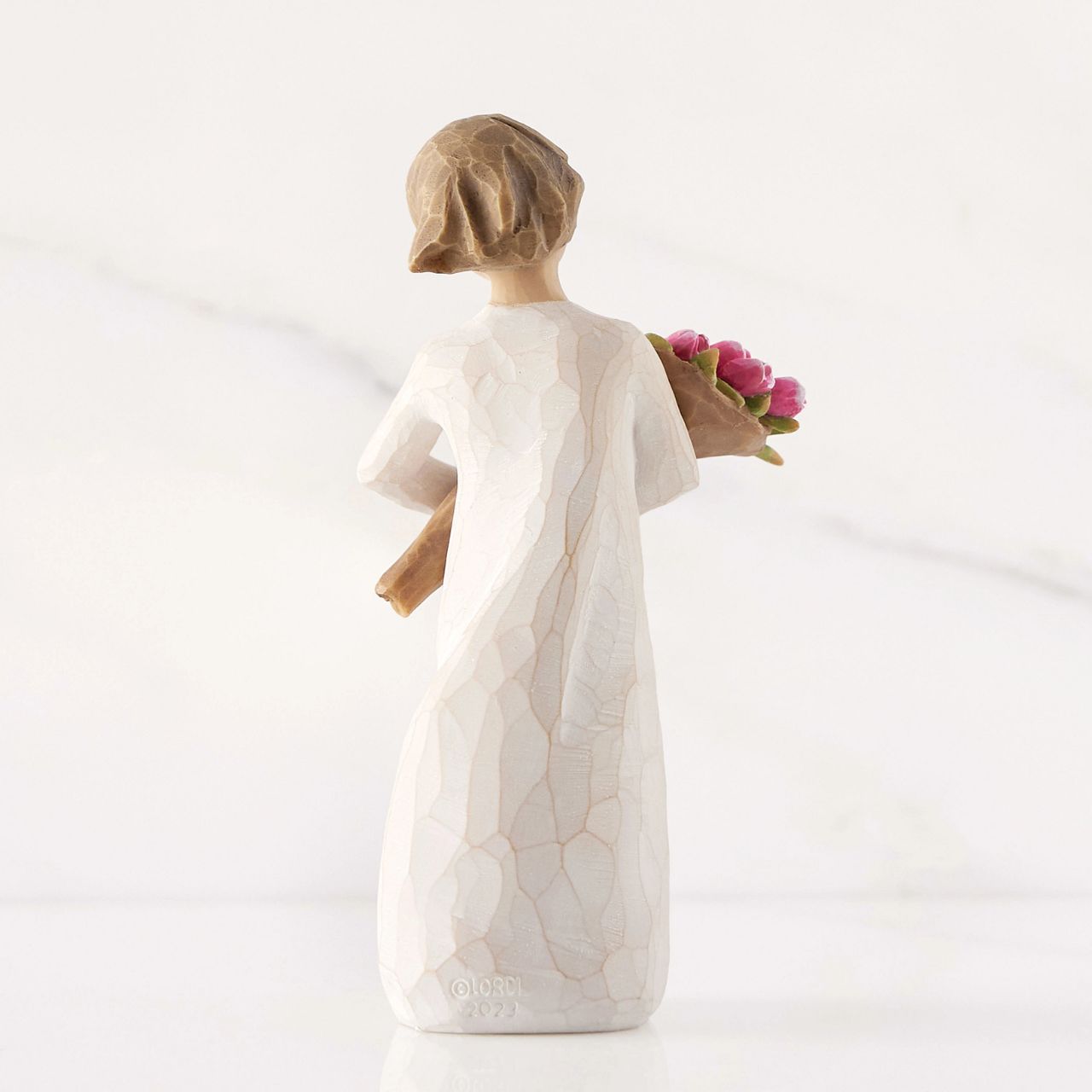 The bright and boldly pink colour of these tulips can represent courage, strength and confidence. One of the earliest blooms in spring, tulips are associated with hope and renewal. The large bouquet can represent one's community of support and friendship.