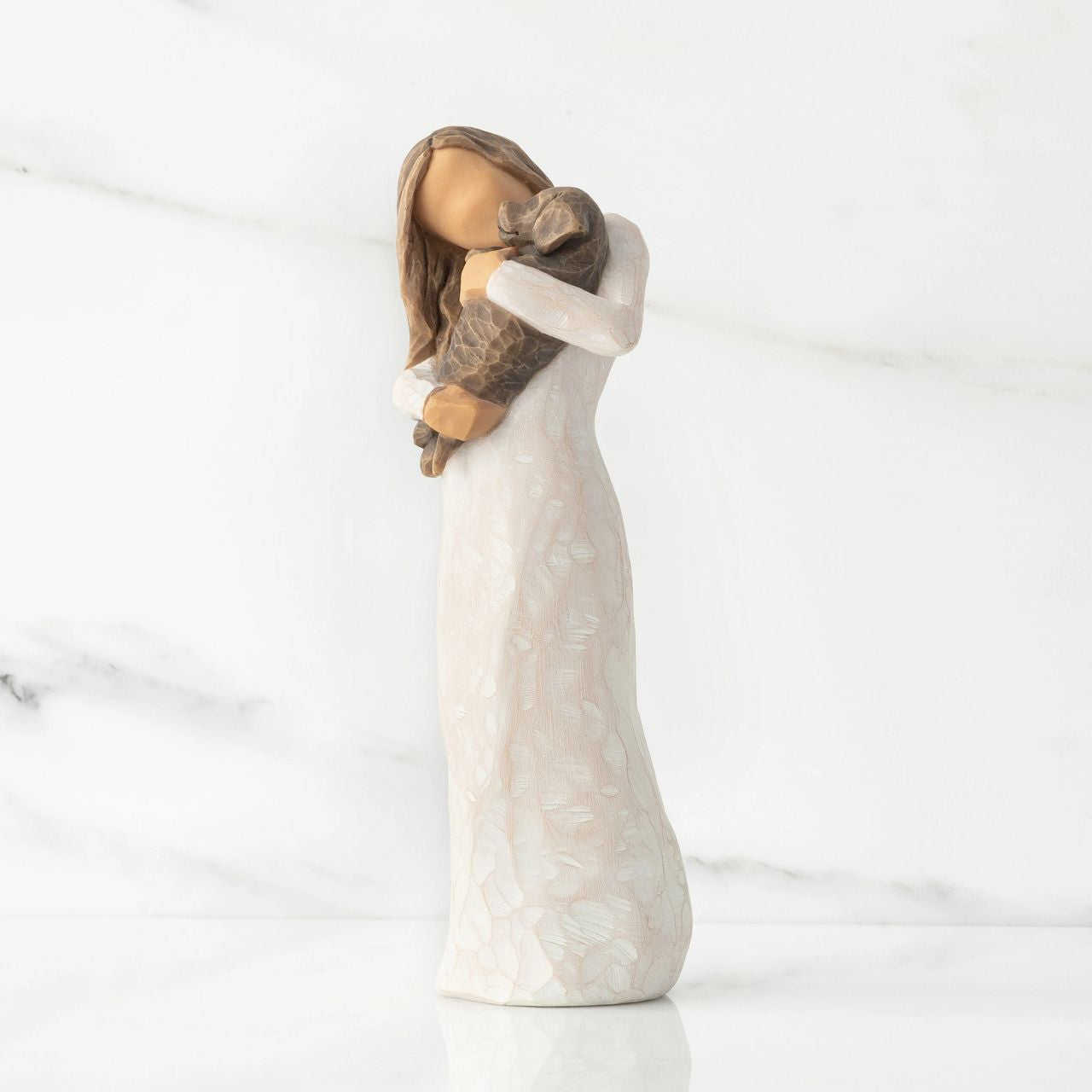 Adorable You - Dark Dog by Willow Tree  Willow Tree is an intimate line of figurative sculptures representing sentiments of love, closeness, healing, courage, hope...all the emotions we encounter in life " When carving this figurine, I was influenced by the postures of classical sculptures, where the line of the shoulders is in opposition to the hips, or contrapposto.